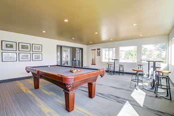 Community clubhouse billiards table and game room area.